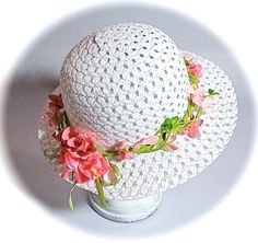 "This little girls Easter bonnet or tea party hat is a white open weave sun hat with a wired leaf green garland that wraps the crown.  The garland is sprinkled with velvet flowers in shades of pink.  The hat is perfect for Easter or a flower girl in a garden wedding!  This hat measures 20-1/2\" at the crown...be sure to measure mid forehead before ordering!  To view my entire collection of Girl's Hats click on this Section.... https://www.etsy.com/your/shops/Marcellefinery/sections/16935555 Prev Handmade Sun Hat For Spring Garden Party, Adjustable Flower Sun Hat For Spring, White Floral Shaped Sun Hat For Summer, Whimsical Spring Sun Hat, White Flower Shaped Sun Hat For Summer, Handmade Adjustable Sun Hat For Garden Party, White Flower-shaped Sun Hat For Summer, White Flower Sun Hat For Vacation, Brimmed Sun Hat For Spring