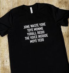 a black t - shirt with white words on it that says,'june waste yore toye momme yo all redu the voice inside move yedd