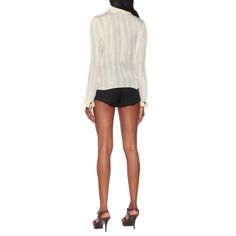 This ivory-white top from Saint Laurent will be the conversation piece at your next dinner party. With a frilly pierrot collar, poet cuffs, and golden lamé stripes throughout, it's a striking designVertical stripe patternMetallic threadingRuffled detailingLong sleevesConcealed front button fastening.96% silk, 4% metallic fibreDry clean onlyMade in France Elegant Office Tops With Striped Collar, Luxury White Party Blouse, Elegant Office Blouse With Striped Collar, Elegant Spring Tops With Striped Collar, Chic Fitted Blouse With Striped Collar, Elegant Formal Tops With Striped Collar, Elegant Formal Top With Striped Collar, Elegant White Top With Striped Collar, Elegant White Blouse With Striped Collar