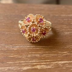 14k Yellow Gold Ruby Gemstone 6.8gm Size 7.5 Resize available under request Thank you for visiting our shop! Follow us on Instagram https://www.instagram.com/dmkjewelry_/ 𝑫𝑴𝑲 𝑱𝒆𝒘𝒆𝒍𝒓𝒚 Heirloom 14k Gold Flower Ring With Gemstone, 14k Gold Red Multi-stone Cluster Ring, Heirloom Multi-stone Ruby Ring In 14k Gold, Heirloom Ruby Cluster Jewelry, Yellow Gold 14k Gemstone Flower Ring, Red 14k Gold Flower Ring For Anniversary, Classic 14k Gold Flower Ring With Gemstone, Fine Jewelry Ruby Cluster Ring Stamped 14k, Gold Cluster Ruby Ring