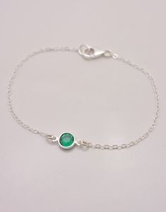 SOLID STERLING SILVER CHAIN - A WONDERFUL KEEPSAKE This beautiful birthstone bracelet is made using quality 925 sterling silver chain that closes with a silver lobster clasp. The lovely Swarovski crystal is available in your choice of birthstone color (see chart) and measures approximately 6mm across. SIZING - IMPORTANT: To determine bracelet size, measure snugly around your wrist and add 1/2 inch to get your bracelet size. **Please note that Swarovski uses the same crystal color (Siam) for both Tiny Pearl Necklace, Best Friend Bracelet, Friend Bracelet, Dot Necklace, Dainty Choker, Friend Bracelets, Birthstone Colors, Birthstone Bracelet, Birthstone Bracelets