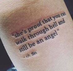 a tattoo saying she's proof that you can walk through hell and still be an angel