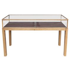 a wooden table with glass top and legs