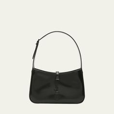 Saint Laurent "Le 5 À 7"  monogram hobo bag in patent calf leather. Shoulder bag that tucks under the arm for a sleek, retro-chic look. Adjustable shoulder strap, 8" drop Center flap top with YSL logo, tab closure. Black-tone hardware. Interior, zip pocket. Approx. 9"H x 6.3"W x 2.6"D. Made in Italy Glossy Finish Satchel Shoulder Bag, Glossy Finish Top Handle Shoulder Bag, Classic Business Shoulder Bag With Glossy Finish, Classic Glossy Business Shoulder Bag, Classic Leather Shoulder Bag With Glossy Finish, Classic Shoulder Bag With Glossy Finish, Classic Shoulder Bag With Glossy Finish For Everyday Use, Classic Glossy Finish Shoulder Bag For Office, Sleek Shoulder Bag With Branded Hardware