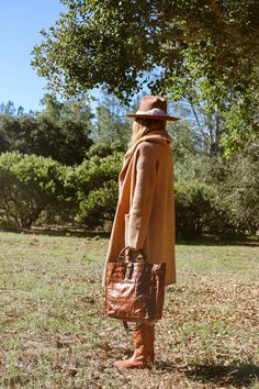 A match made in heaven: The Lennox Sweater Coat + The Crossroads Leather Bag 🤎⁠ We're obsessed with this bohemian chic look, put together by our free-spirited muse @cayden.naughton featuring our best-selling Lennox oversized cardigan & the fan-favorite leather Crossroads tote bag!⁠ ⁠ #bohemianstyle #sweaterweather #californiawinter #casualoutfit #cozyvibes #stylinginspo #lotd #ootd #momlife #californiastyle Chic Brown Long Sweater Coat, Cozy Oversized Sweater Coat For Everyday, Oversized Cozy Sweater Coat For Everyday, Brown Sweater Coat For Winter, Oversized Beige Wool Coat For Fall, Oversized Brown Wool Coat For Fall, Oversized Brown Outerwear For Everyday, Cozy Brown Sweater Coat For Fall, Oversized Brown Sweater Coat For Fall