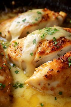 some chicken with cheese and parsley in a skillet