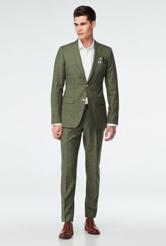 For those of you with a taste for the finer things in life, there's the delightfully detailed Stockport Suit. This fabric's unique weave, containing dyed wool and just a hint of ultra-thin raw linen, gives it a uniquely geometric texture-that only looks better the closer you get. Mens Bridal Suits, Earth Tone Suit Men Wedding, Olive Suit Wedding, Olive Suit, Custom Blazer, Green Suit Men, Olive Blazer, Desert Tones, Olive Green Suit