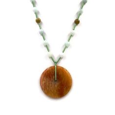 "Chinese Orange Jade Donut Amulet Necklace - Orange Donut Amulet Necklace - Jade Beads Good Luck Amulet Necklace on green hand-knotted silk cord.30\" long with 2.5\" pendant drop. very good to excellent condition. Free Domestic Shipping VISIT OUR NEW Etsy Shop---> DecoDivaJewelryShop <--- For Handcrafted Heirloom Quality Antique and Art Deco Collectible Originals & Reproductions with Vintage Gemstones! https://www.etsy.com/shop/DecoDivaJewelryShop **International shipping is NOT FREE u Spiritual Jade Beaded Pendant Necklace, Spiritual Jade Crystal Necklaces With Round Shape, Spiritual Beaded Chain Necklace With Round Pendant, Spiritual Necklace With Beaded Chain And Round Pendant, Jade Necklace With Round Gemstone Beads, Bohemian Round Jade Jewelry, Jade Amulet Necklace With Round Pendant, Spiritual Jade Round Pendant Necklace, Handmade Round Jade Beads