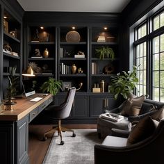 a home office with black walls and wooden flooring, built in shelving units