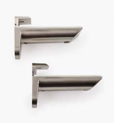 pair of stainless steel cabinet handles on white background with clippings to each side