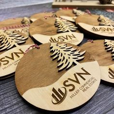 wooden christmas ornaments with the names and date on them