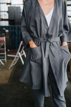 "Doha Kimono - Grey Linen Kimono - Long Linen Kimono - Oversized Kimono - Summer Coat - Women Kimono - Linen Jacket - Oversized Jacket -----------We do make custom made clothes. Just let us know your measurements ------------------- * Doha kimono * Handmade * Colour: grey * 100 % washed & softened Lithuanian linen * 205 g/m2 * Pockets * Belt * Perfect for maternity * Length of the kimono - 95 cm * Length of the sleeves - 45 cm The model is 178 cm height and is wearing size M. Choose your siz Fall Outerwear With Kimono Sleeves For Daywear, Fall Robe With Pockets And Long Sleeves, Casual Fall Daywear Robe, Casual Long Sleeve Kimono For Work, Long Sleeve Kimono With Pockets For Loungewear, Casual Outerwear With Kimono Sleeves, Casual Outerwear With Kimono Sleeves And Pockets, Casual Robe With Relaxed Fit For Fall, Casual Relaxed Fit Robe For Fall