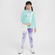 This 2-piece set was designed for easy going days home on the couch just as much as it is for fun times at the park. The tee is made of soft drapey jersey with a slightly flared cut that allows for freedom of movement. The tagless crewneck provides easy wear and the long sleeves add cozy, lightweight warmth. The matching leggings have a comfy stretch waistband and are made of stretch poly enhanced with quick-drying, moisture-wicking Dri-FIT technology to help keep your child cool and dry as they Casual Long Sleeve Activewear For Play, Legging Nike, Matching Leggings, Black Raspberry, Leggings Set, Nike Kids, Fun Times, Easy Going, Easy Wear