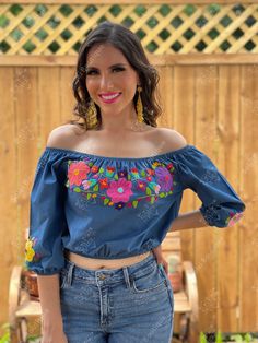 This Beautiful Off the Shoulder Crop Top is the perfect Top for a fun day out. It's made out of fine, soft denim and has elastic around the waist. The floral design is hand embroidered. This blouse is hand embroidered and the embroidered colors vary on each blouse making each blouse one of a kind. More colors available here: https://www.etsy.com/es/listing/855531148/crop-top-manga-larga-blusa-artesanal?ref=listings_manager_grid Purchase the Artisanal Mexican earrings modeled here: https://www.et Floral Embroidered Tops For Spring Festival, Spring Fitted Tops With Multicolor Embroidery, Fitted Tops With Multicolor Embroidery For Spring, Fitted Top With Multicolor Embroidery For Vacation, Fitted Tops With Multicolor Embroidery For Vacation, Fitted Multicolor Embroidered Top For Vacation, Mexican Bridesmaid Dresses, Mexican Earrings, Top Manga