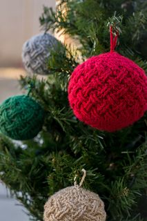 crocheted ornaments hanging from a christmas tree