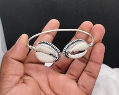 my shop name - Silverartisanstoar 925 Sterling Silver Bangle,, Money Cowrie Bangle, Shell Bangle, Cowrie Bracelet, Natural Shell Bangle, Easter Gifts, Halloween Gifts,  https://www.etsy.com/in-en/shop/Silverartisanstoar? About this item Stamped: 925 i make jewelry for a very special kind of Women's men's ,This stunning is handcrafted by one of our talented artisans. It is set in precious Fine Jewelry 925 Sterling Silver Jewelry, Polished to a brilliant luster> You can also contact us for a separate order, or place an order? MEANING: Cowrie shells were used as far back as 1747 as currency and have a history of this in many countries all over the world Cowrie Bracelet, Sterling Silver Bangle, Cowrie Shell, Sterling Silver Bangles, Silver Bangle, Easter Gifts, 925 Jewelry, Silver Bangles, 925 Sterling Silver Jewelry