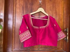 Hand embroidered ready made saree blouse / crop top/stitched saree blouse usa / pink saree blouse/modern blouse/zardosi blouse/red elbow sleeve saree blouse/ pure silk blouse/ maggam work blouse        It is very true that a perfect blouse is the one which makes your saree look stand out !! If you find one of such a style that you have been wanting to have then dont let it go !! we carry such unique trending blouses that instantly add a stylish look to any saree !!     Well..!! we understand that you may not get in your desired size/pattern, here you go with customization according to your size/pattern which we can deliver in 1-2 weeks of time period !!      Here is a beautiful Hand embroidered zardosi work crop top / blouse in pink color that has U neck design emblished with gold hand emb Silk Blouse Piece With Pink Dori Work, Pink Chanderi Blouse With Zari Work, Pink Silk Blouse Piece With Dori Work, Pink Art Silk Blouse Piece With Dori Work, Pink Dola Silk Blouse With Traditional Drape, Pink Chanderi Blouse With Resham Embroidery, Pink Dola Silk Blouse Piece With Cutdana, Pink Resham Embroidered Chanderi Blouse, Pink Chanderi Blouse For Festivals