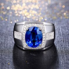 "2.50 Carat Blue Oval Cut Sapphire & White Round Cut Diamond Men's Engagement Ring in 925 Sterling Silver  ✦ Handmade, high-quality item! ✦ Material: 925 Sterling Silver, Solid 10 Carat/14 Carat Gold (can be made in white/rose/yellow gold) ✦ Centre Stone: Simulated Diamond/Moissanite Diamond ✦ Stone Shape: Oval ✦ Stone Color: White, Blue ✦ Size/Weight: 2.50 Ct ✦ Side stones: Round ✦ Clarity: Excellent If you like this ring, please ♡ it and save it for later. ✦ Remember - All my rings are fully c Ring Party Jewelry, Mens Rings Fashion, Wedding Ring Sizes, Mens Engagement, Sapphire Wedding, Zircon Ring, Birthday Jewelry Gift, Engagement Rings For Men, Blue Sapphire Rings