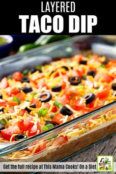 layered taco dip recipe in a glass dish with text overlay that reads, layered taco dip get the full recipe at this mama cooks on a diet