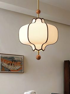 a lamp hanging from the ceiling in a living room