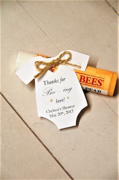 a baby's first birthday candy bar is tied up and sitting on the floor