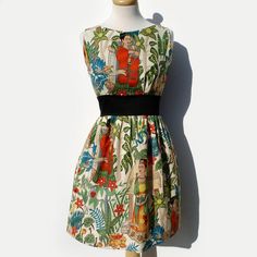 Frida+Kahlo+Retro+Inspired+Dress Comfortable+and+definitely+a+looker,+perfect+for+a+summer+day+on+the+town+or+a+show. Frida+comes+alive+in+this+fresh+novelty+fabric.+Frida+is+in+a+tropical+forest+setting+surrounded+by+her+monkey+and+parrot+companions.+The+back+has+a+wonderful+V-shape+attribut... Frida Kahlo Dress, Vestidos Pin Up, Retro Inspired Dress, Pinup Dress, Boho Bridesmaid, Pin Up Dresses, Mexican Dresses, Rockabilly Dress, Vintage Inspired Dresses