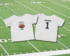 Celebrate your baby's first birthday with our Custom First Year Down Football Shirt! Perfect for little sports fans, this adorable t-shirt features a fun football theme and can be personalized with your baby's name. Available in sizes 12 months and 18 months, our shirts are designed to make your little one's big day even more special. This custom design allows you to personalize the shirt with your baby's name, replicating a classic sports jersey. The football theme is perfect for football lovers, making it ideal for celebrating your baby's first year in a sporty style. Made from soft and breathable fabric, the shirt ensures your baby stays comfortable all day long. The back of the shirt features your baby's name and the number 1, just like a real sports jersey, adding a special touch to t White Sports T-shirt With Number Print, White Number Print Sports T-shirt, White T-shirt With Number Print For Sports Season, Team Spirit White T-shirt With Number Print, White Number Print Top For Football Season, White Number Print Top For Football, White Number Print T-shirt For Football Season, Number Print Short Sleeve Top For First Birthday, Sporty Crew Neck T-shirt For Playtime