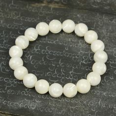 Mother of Pearl Stretch Bracelet Size Approx. 6 1/2" Bead Size : 10mm Hand-crafted at Beads of Paradise NYC Stretch Bracelet, Bracelet Sizes, Stretch Bracelets, Pearl Beads, Mother Of Pearl, Pearl Necklace, Paradise, Hand Crafted, Bracelet