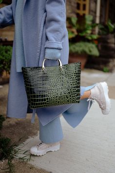 Elevate your style with the Gina Tote Bag, a must-have tote bag crafted from high-quality Italian leather. The unique two-tone colorway features contrasting shades of vibrant and deep green that exude sophistication and bold elegance. The croc-embossed texture adds an exotic touch, while the structured design and reinforced base maintain its sleek silhouette no matter what you carry. Whether pairing it with your favorite power suit or a little black dress, the SISTER EPIC Gina Tote Bag is design Green Luxury Bag For Errands, Luxury Green Bags For Errands, Luxury Green Satchel For Daily Use, Luxury Green Satchel For Errands, Green Satchel With Leather Handles For On-the-go, Green Top Handle Shoulder Bag For Shopping, Green Top Handle Bag For Errands, Luxury Green Tote Satchel, Luxury Green Shoulder Bag For Errands