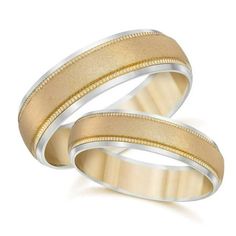 two wedding bands with gold inlays on each side, set against a white background