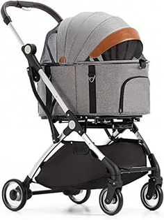 a baby stroller with a grey seat and brown handlebars on the wheels