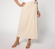 A season of social invites awaits, but what to wear? From garden parties to backyard barbecues, this wrap utility skirt fits in perfectly with your plans. Simply dress it up with sandals and a blouse, and bring it back down to casual with some tennies and a graphic tee. From Peace Love World. Summer Midi Wrap Skirt, Beige Wrap Skirt For Summer Day Out, Chic Wrap Skirt For Spring, Spring Lined Wrap Skirt, Summer Asymmetrical Wrap Skirt With Lining, Fitted Wrap Skirt For Summer, Beige Midi Wrap Skirt For Summer, Summer Relaxed Wrap Skirt With Lining, Spring Cotton Midi Wrap Skirt