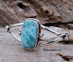 Larimar Bangle, 925 Sterling Silver Bangle, Dainty Bangle, Handmade Bangle, Women Bangle, Open Cuff Bangle, Adjustable Bangle, Gift For Her Description Metal :- 925 Sterling Silver Style :- Bangle Benefit of Bangle Benefits Of Larimar Larimar is said to enlighten and heal in a physical, emotional, mental and spiritual way. It stimulates the heart, throat, third eye and crown chakras facilitating inner wisdom and outer manifestation. It represents peace and clarity, radiating healing and love ene Handmade Adjustable Larimar Bracelets, Silver Larimar Bracelets As Gift, Adjustable Larimar Jewelry For Anniversary, Hippie Bracelets, Inner Wisdom, Sterling Silver Bangle, Handmade Bangles, Adjustable Bangle, Silver Style