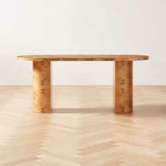 a wooden table sitting on top of a hard wood floor