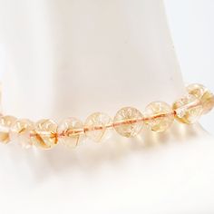 Embrace the Radiant Beauty of CitrineDiscover the captivating allure of the Citrine Bracelet. Adorned with 8mm citrine beads, this bracelet showcases the radiant and vibrant beauty of this gemstone. Each bead is carefully selected to exhibit the golden hues and sparkling clarity of citrine, creating a truly enchanting accessory that brings warmth and positivity to your look.Uplifting Energy and AbundanceCitrine is known as the stone of abundance and joy. It radiates positive energy, uplifts the Spiritual Citrine Crystal Bracelet With Gemstone Beads, Healing Citrine Crystal Bracelet With Round Beads, Adjustable Citrine Gemstone Beads Crystal Bracelet, Spiritual Citrine Round Bead Bracelets, Spiritual Citrine Bracelets With Round Beads, Adjustable Citrine Beaded Bracelets With Round Beads, Citrine Natural Stones Beaded Bracelets, Citrine Gemstone Beads Crystal Bracelet, Citrine Gemstone Beaded Bracelets