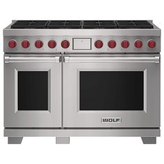 an oven with two double doors and red knobs on the front, in stainless steel