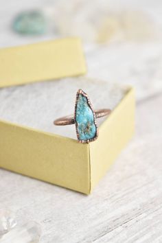 Your raw gemstone artisan ring collection is not complete without a raw turquoise ring. Handmade with healing crystals and natural stones, this copper jewelry awakens the wild woman. The raw turquoise jewelry is made with electroformed copper, making each piece unique and one of a kind, just like you. Embrace your intuitive nature and click through to see more raw gemstone jewelry! Bohemian Raw Stone Rings For Healing, Bohemian Rings With Raw Stone For Healing, Bohemian Raw Stone Healing Rings, Bohemian Rings With Raw Stone, Bohemian Turquoise Chrysocolla Ring With Natural Stones, Bohemian Turquoise Ring With Natural Chrysocolla, Bohemian Turquoise Ring With Chrysocolla, Bohemian Turquoise Open Ring With Natural Stones, Bohemian Chrysocolla Turquoise Ring