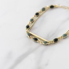 A beautiful gold plated double braceet dotted with green beads. Indisa jewellery will be lovingly hand wrapped and packaged within our letterbox and eco-friendly signature boxes for that extra special unboxing experience. Sending a gift? Personalise your item with one of our free message cards. Enter your chosen gift card number in the box named 'add your personalisation' 1.Sending smiles your way 2.Birthday vibes 3.I couldn't resist 4.Did someone say birthday girl? 5.Smile, shine, celebrate 6.S Gold Double Strand Beaded Bracelet Gift, Gold Double Strand Beaded Bracelet For Gift, Green Beaded Chain Bracelets For Jewelry Making, Green Beaded Chain Bracelet For Gift, Green Beaded Chain Bracelet For Jewelry Making, Green Multi-strand Bracelets For Jewelry Making, Dainty Green Gold Plated Bracelets, Minimalist Green Beaded Chain Jewelry, Green Minimalist Beaded Chain Jewelry