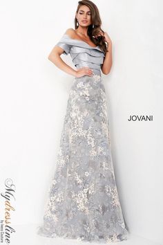 Indulge in elegance with the Jovani 02921 gown. Crafted from luxurious lace and taffeta, this A-Line masterpiece features a bateau neckline, short sleeves, and pleated skirt for added sophistication. Perfect for evening events, special occasions, and plus sizes. Elevate your style effortlessly. Luxury Fitted Chiffon Mother Of The Bride Dress, Luxury Strapless Fitted Mother Of The Bride Dress, Luxury Lace Bodice Mother Of The Bride Evening Dress, Luxury Mother Of The Bride Dress With Lace Bodice, Mother Of The Bride Dress Summer Long, Luxury Mother Of The Bride Evening Dress For Spring, Luxury Lace Bodice Dress For Mother Of The Bride, Summer Flair Mother Of The Bride Dress, Mother Of Bride Dresses 2022