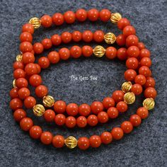 Thank you for coming in! Mediterranean Sardinia Coral sphere bead, no dye, 100% natural tomato red color. The beads are premium quality, you do not find hairline cracks which are common with Mediterranean coral beads. Classic stretchy bracelet with 18k solid yellow gold fluted spacers!  You'll get one of the bracelets you see! Bracelet 1:  6.2mm corals, 7inch length Bracelet 2: 5.88m-6.2mm corals, 7inch length Bracelet 3: 5.25mm-5.7mm corals, 6.8inch length   MATERIAL: 18k Solid gold, Natural co Red Carnelian Beaded Bracelets With Gemstone Beads, Red Carnelian Bracelets For Meditation, Red Carnelian Beaded Bracelets, Red Carnelian Bracelets With Polished Beads, Red Gemstone Beads Bracelets For Meditation, Elegant Red Carnelian Beaded Bracelets, Red Carnelian Beaded Bracelet With Round Beads, Red Carnelian Beaded Bracelets With Round Beads, Red Carnelian Round Beads Bracelet