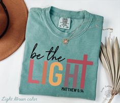 Be The Light Shirt Gift For Christians, Mathew 5:14 Sweatshirt, Bible Verse Sweater, Religious Hoodie, Faith Outfit, Church Sweatshirt Hi, thank you so much for shopping with us! ❤️ ◦ ◦ ◦ ◦ ◦ size and material ◦ ◦ ◦ ◦ ◦ ◦ Comfort Colors® Original Garment-Dyed T-shirt ◦ Unisex Adult T-Shirt ◦ Soft and comfy ◦ Garment-dyed and soft-washed for a comfortable vintage look and feel ◦ Relaxed fit ◦ 100% ring-spun cotton ◦ The way that we print our sweatshirts is Direct-to-Garment printing, meaning that the ink is printed INTO the shirt. This provides an extremely durable and professional look (not vinyl).  ❤️❤️ IF YOU WANT AN OVERSIZED LOOK PLEASE CHOOSE A SHIRT THAT IS 2 SIZES LARGER THAN YOUR USUAL SIZE  ◦ ◦ ◦ ◦ ◦ care instructions ◦ ◦ ◦ ◦ ◦ ◦ Machine wash: cold (max 30C or 90F) ◦ Do not bleach Be The Light Tshirt Designs, Church Tshirt Designs, Be The Light Shirt, Church Tshirts, Mathew 5, Boho Christian, Church Shirt, Bible Verse Shirt, Be The Light