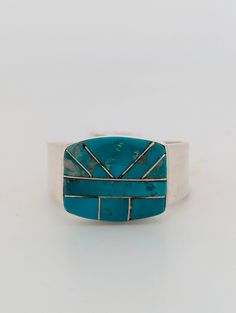 New Native American handmade sterling silver ring with turquoise and sterling intarsia design by Navajo artist Avery Norton Buckshot Billy is a stunning Native American handmade sterling silver ring featuring a unique turquoise and sterling intarsia design. Crafted by Navajo artist Avery Norton, this piece showcases the intricate artistry and traditional techniques of Native American jewelry. The combination of the sterling silver, the turquoise, and the intarsia design creates a truly unique an Handmade Sterling Silver Rings, American Jewelry, Native American Jewelry, Traditional Techniques, Handmade Sterling Silver, Sterling Silver Ring, Nativity, Native American, Silver Ring