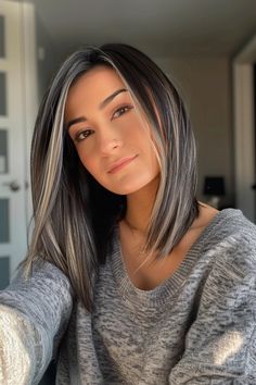 Ditch the dye and rock your greys with pride using these 40 silver hair highlights ideas. From dimensional brown hair with grey highlights to cool ash grey blends, there are gorgeous ways to tastefully show off your greys. Click the pin to explore all of them now and save your favorites! Partial Silver Highlights For Dark Hair, Blondish Grey Hair Color, Bayalage On Greying Hair, Ashy Blonde Grey Blending, Brunette Hair Color Ideas To Cover Grey, Dark Brown Gray Balayage, Silver And Grey Hair Color Ideas, Brown Salt And Pepper Hair, Grey Hair Lob Long Bobs