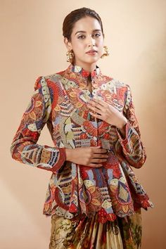 Multi color godet jacket with multi motif African embroidery work. Comes with floral printed draped skirt with tassels and embroidered work. - Aza Fashions Fitted Multicolor Nehru Jacket With Long Sleeves, Fitted Long Sleeve Nehru Jacket With Motifs, Fitted Multicolor Embroidered Blouse With Cutdana, Multicolor Top With Cutdana In Traditional Drape, Fitted Multicolor Embroidered Cutdana Blouse, Fitted Multicolor Long Sleeve Nehru Jacket, Fitted Multicolor Outerwear With Intricate Embroidery, Skirt With Tassels, Saaksha And Kinni