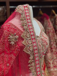 A traditional dark cerise pink flared skirt is decorated with floral motifs enhanced with gleaming sequins, cut dana, zardozi, pearl, stone and zari embroidered details radiates charm.Completed look with similarly embroidered blouse and net dupatta. Fabric: Silk Size:38/M Ready to Ship! Pink Lehenga With Dabka Work In Traditional Drape, Pink Lehenga With Dabka Work, Traditional Embellished Gown With Traditional Drape, Traditional Embellished Designer Gown, Pink Bollywood Lehenga With Dabka Work, Bollywood Style Pink Lehenga With Dabka Work, Traditional Embellished Gown, Pink Dabka Work Choli For Reception, Pink Gown With Dabka Work In Traditional Drape