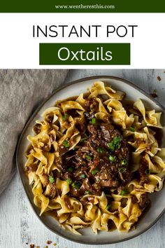 an image of instant pot oxtails on a plate with text overlay that reads instant pot oxtails