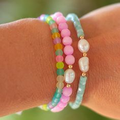 A little beachy, a little boho, and so fun, this sea glass bracelet features matte glass beads in fun tropical-inspired hues. It's great for stacking and mixing with our other colorful stretch bracelets. Wear this with your favorite summer tees and shorts or summer dresses! Measures approximately 6.5" on high quality stretch cord. Cheap Colorful Beaded Bracelets For Beach Season, Playful Cheap Beaded Bracelets For Beach, Green Stackable Stretch Bracelet For Beach, Multicolor Stackable Stretch Bracelet For Beach, Casual Tiny Beads Stretch Bracelet For Beach, Casual Stretch Bracelet With Tiny Beads For Summer, Turquoise Stretch Bracelet With Tiny Beads For Beach, Stackable Pink Beaded Bracelets For Summer, Pink Stackable Beaded Bracelets For Summer