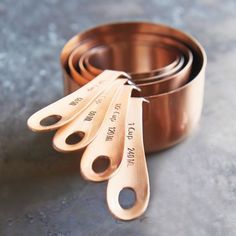 four measuring spoons sitting on top of each other