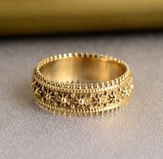 a gold ring sitting on top of a table