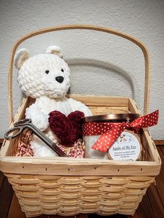 We have put together a beautiful basket with the perfect contents to make a perfect gift. Make someone's day when you present them with this basket full of hand-made candles or wax melts and goodies.  The candle basket includes: 1 basket, craft paper shreds, basket bag and ribbon, 1 large 3-wick Valentine's Day candle of your choice, a crocheted plush teddy bear of your choice, and a pair of silver, metal wick trimmers. Assembly required. The wax melt basket includes:  1 basket, craft paper shre Crocheted Teddy Bear, Holding Heart, Candle Basket, Raffle Prizes, Crochet Teddy Bear, Decorated Jars, Crochet Teddy, Scented Wax Melts, Teddy Bear Plush